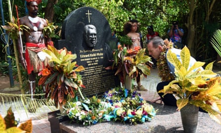 Former prime minister Tony Abbott visits the grave of land rights activist Eddie Mabo in the Torres Strait.