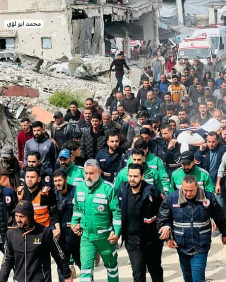 Ambulance staff and other emergency workers among the mourners at Abed Elrahman Hamdouna’s funeral.