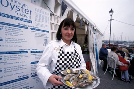 Woman serving oysters at the Oyster Festival, Falmouth
