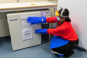 Santosh Kalair, senior pharmacy operations manager, gets the vaccine back from the freezer.
