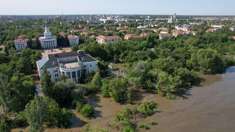 Drone footage shows extent of flood in Russia-controlled Ukrainian town after dam collapse – video