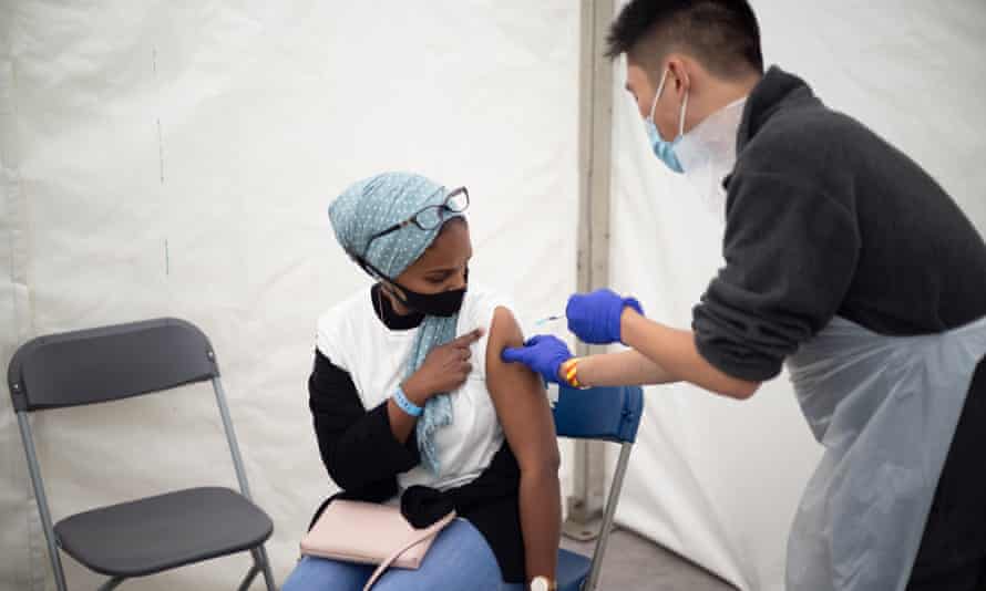 Dhilshana Shiraj receives a dose of the Pfizer vaccine at the Langdon Park festival