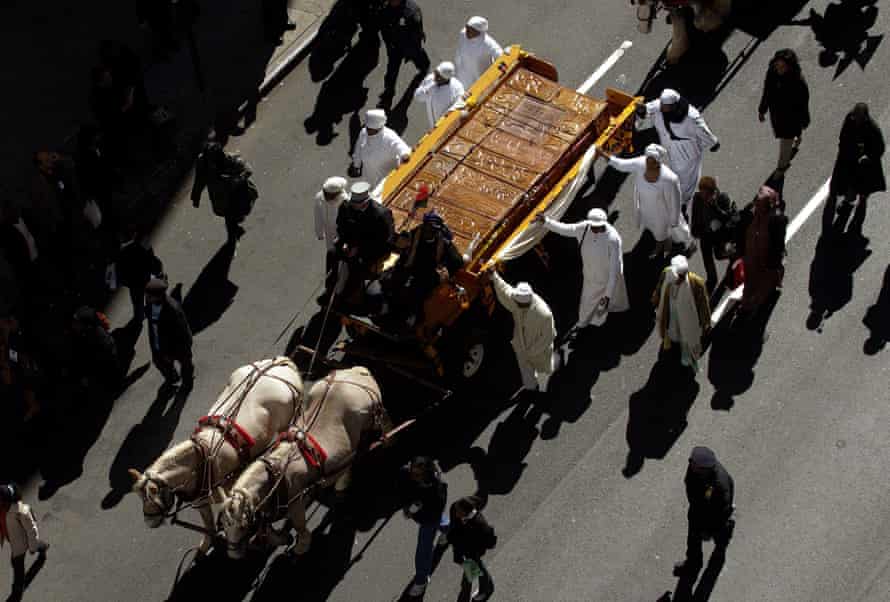 Caskets hand-made in Ghana move up Broadway towards their final resting place in New York – in October 2003.