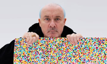 Damien Hirst with a painting from The Currency collection.