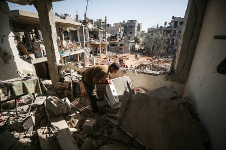 A Palestinian views the damage at his home in Beit Hanoun, Gaza