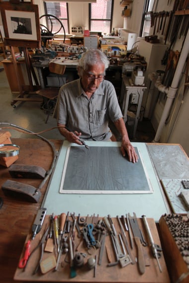 Krishna Reddy in 2011 in his studio, lined with tools.