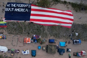 Aerial view of tents and huge American flag