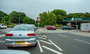 Motorists queue for petrol at the Morrisons petrol Station in Belle Vale, Liverpool this morning