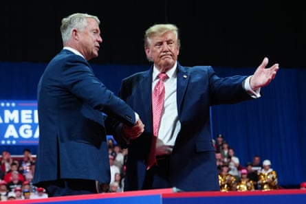 Trump shakes hands with Senator Roger Marshall at the rally in Kansas