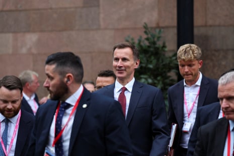 Jeremy Hunt leaving the conference hotel for the hall before his speech.