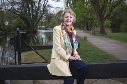 Penelope Keith perched on a dock along a canal