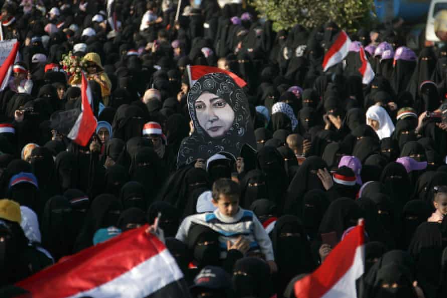 Women carry a poster of Tawakkol Karman during a demonstration to demand the resignation of Yemen’s president, Ali Abdullah Saleh, October 2011.