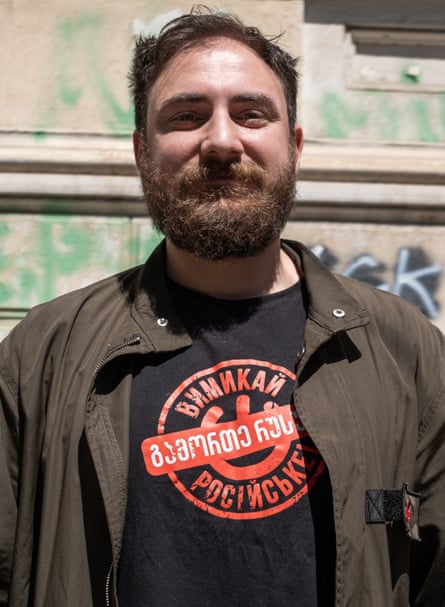 Konstantine Chakhunashvili wearing brown jacket