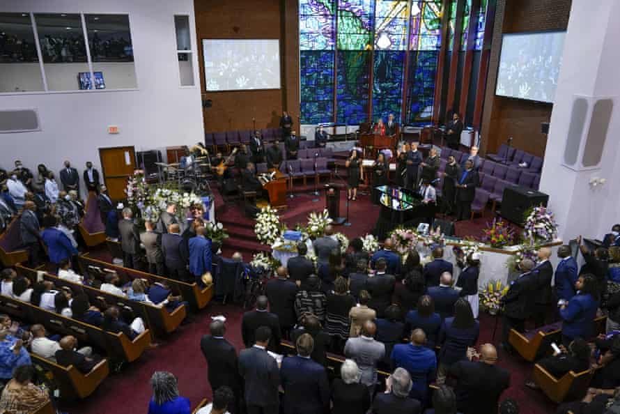 Overhead view of church with pews full and people singing at the front