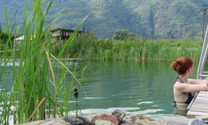 Female swimmer in pool at Naturbad, Gargazzone, South Tirol, Italy.
