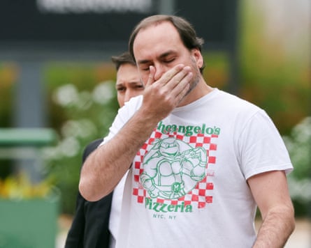 Jair Bolsonaro’s son Carlos looks upset and holds his face