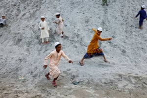 Dhaka, Bangladesh. Children play on the sand