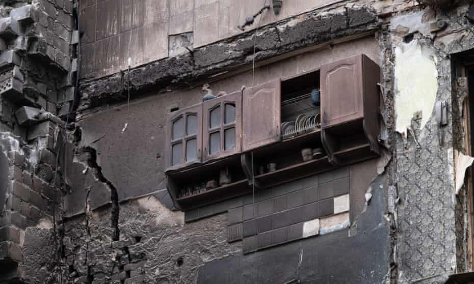 Kitchen cabinet on the wall of a bombed-out building in the town of Borodyanka, near Kyiv.