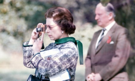 The Queen taking photographs at a horse show at Windsor in 1973.