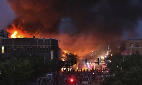 A large fire burns in Minneapolis during a third night of unrest following the death of George Floyd in police custody