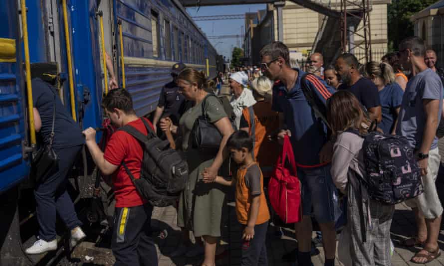 People board an evacuation train in Pokrovsk railway station, eastern Ukraine.