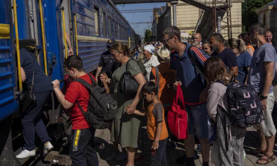 People board an evacuation train in Pokrovsk railway station, eastern Ukraine.