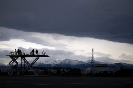 Security forces watch over Air Force One while refuelling at Joint Base Elmendorf in Alaska.