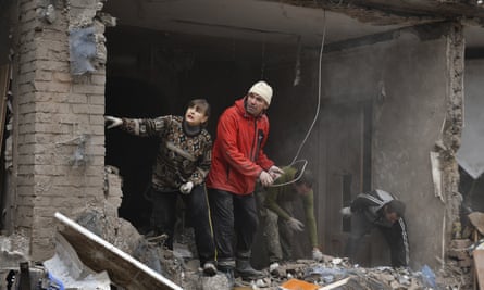 People in partially destroyed house