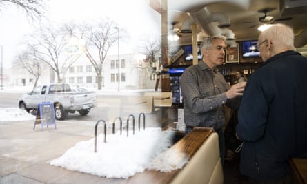 Walsh speaks to Ernie Rairdin at Riley’s Cafe in Cedar Rapids, Iowa.