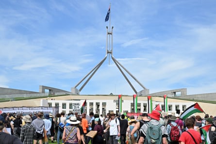 Protesters rally outside Parliament House in Canberra