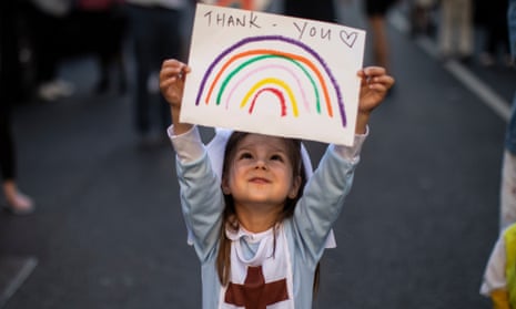 Britain Claps For Carers For a Tenth Week Following Calls For It To End<br>LONDON, UNITED KINGDOM - MAY 28: Maria Sole, 4, dressed in a small nurses outfit holds up a rainbow drawing with the words ‘Thank You’ on it as NHS staff and members of the public take part in the weekly “Clap for Our Carers” event at Chelsea &amp; Westminster Hospital on May 28, 2020 in London, United Kingdom. For 10 weeks, the public have applauded NHS staff and other key workers from their homes at 8pm every Thursday as part of “Clap for Our Carers”. Annemarie Plas, the founder of the campaign, has now called for an end to the new tradition, suggesting that an annual clap should take its place. (Photo by Dan Kitwood/Getty Images)