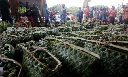 Fruit for sale at a market is stored in bags made from pandanus leaves