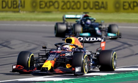 Red Bull Racing’s Max Verstappen (front) and Mercedes’ Lewis Hamilton race at the Abu Dhabi Grand Prix in 2021.