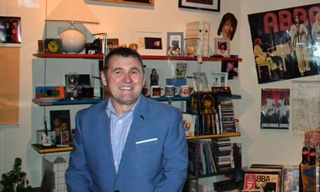 Andrew Boardman with his collection of almost 2,500 items of Abba memorabilia on display in London.