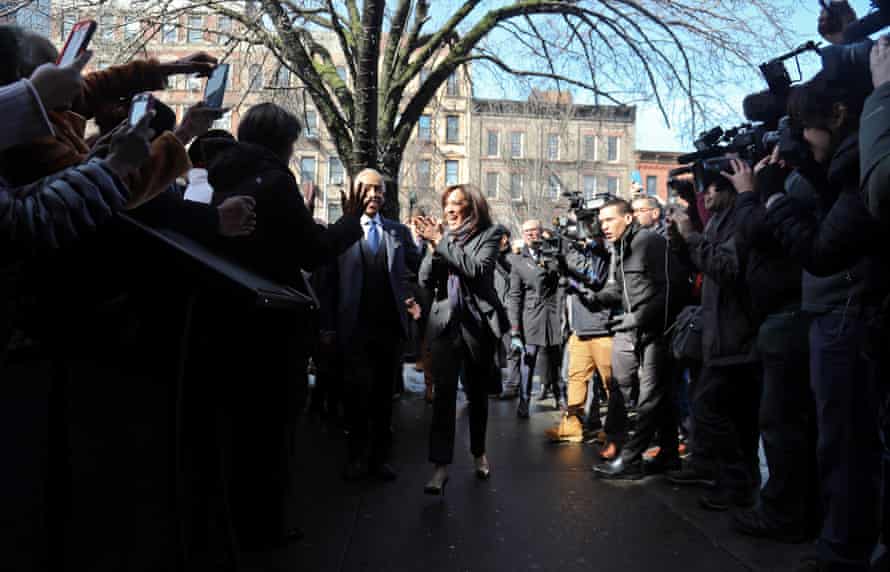 Civil rights leader Rev. Al Sharpton escorts Kamala Harris, D-Calif., center, past media and well wishers as they arrive for a lunch meeting at Sylvia’s Restaurant in the Harlem neighborhood of New York in February 2019.