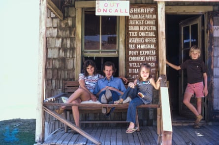 The Stewart family on a wooden porch in the 1970s