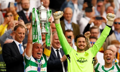 Scott Brown (left) lifts the trophy after Celtic’s victory.