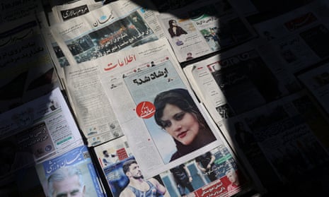 A newspaper with a cover picture of Mahsa Amini