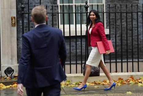 Grant Shapps, the business secretary, and Suella Braverman, the home secretary, arriving for cabinet this morning.