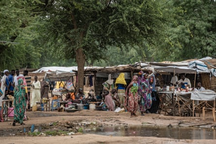 People gather at an outdoor market
