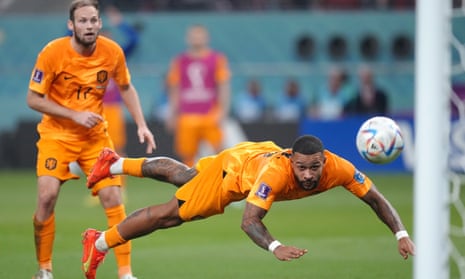 Netherlands' Memphis Depay with a diving header towards goal that is saved