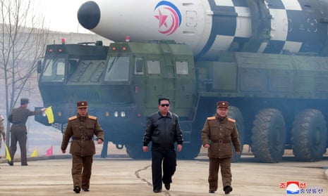 North Korean leader Kim Jong-un walks away from a missile in a photo released on 24 March 2022 by the Korean Central News Agency.