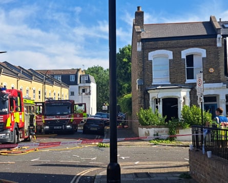 it is a stone Victorian house at the end of a terrace on a corner, and the front bay window has been blown out. Fire engines are parked outside