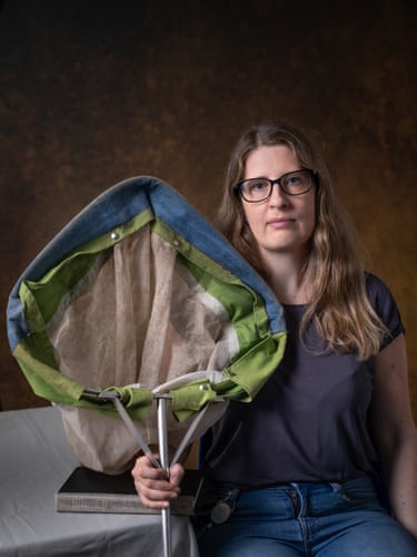 A woman holds a large net