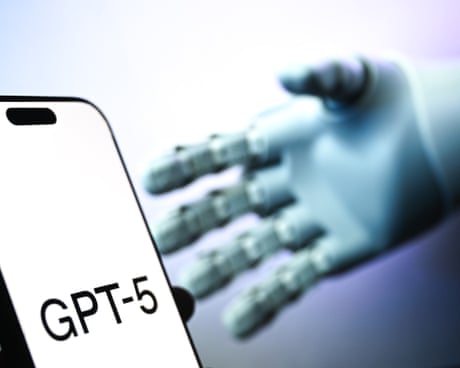 Image 3: GPT-5 written on phone in front of a robotic hand
