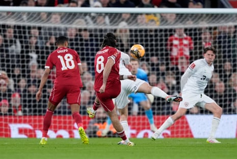 Liverpool's Dominik Szoboszlai scores from distance.