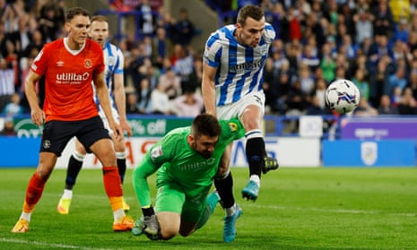Luton Town’s Matt Ingram tussles with Huddersfield Town’s Harry Toffolo.