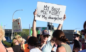abortion rights supporters hold signs
