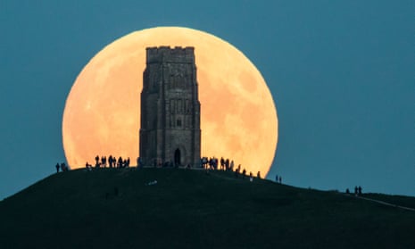 A lunar eclipse behind Glastonbury Tor in 2015.