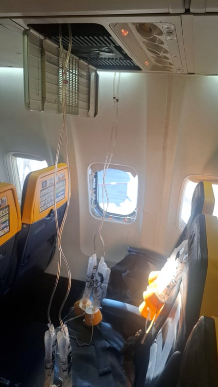 A broken window and the interior of the Ryanair aircraft